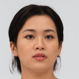 Neutral asian young-adult female with medium  brown hair and brown eyes