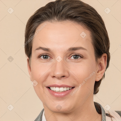 Joyful white young-adult female with short  brown hair and brown eyes