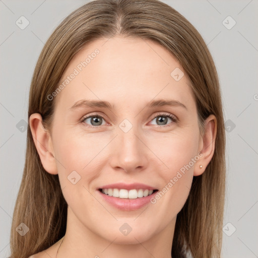 Joyful white young-adult female with long  brown hair and grey eyes