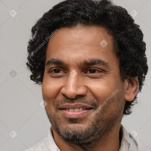 Joyful latino adult male with short  black hair and brown eyes