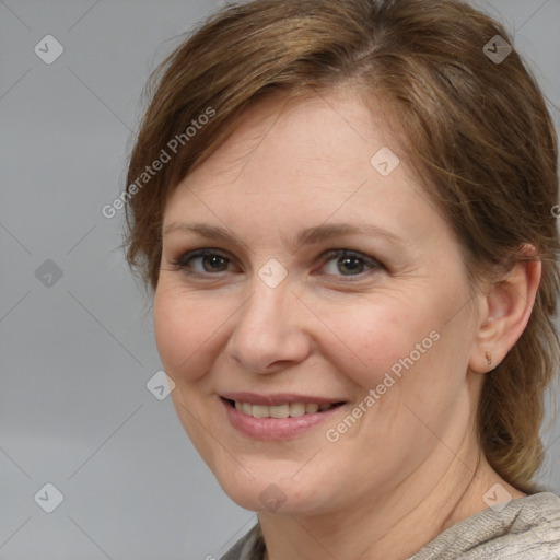 Joyful white adult female with medium  brown hair and brown eyes