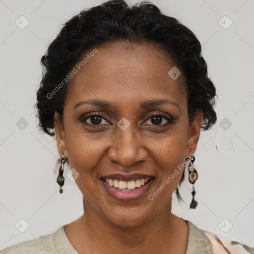 Joyful black adult female with short  brown hair and brown eyes