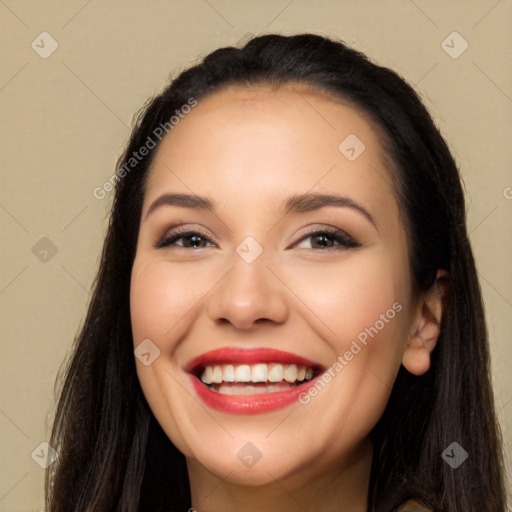 Joyful white young-adult female with long  black hair and brown eyes