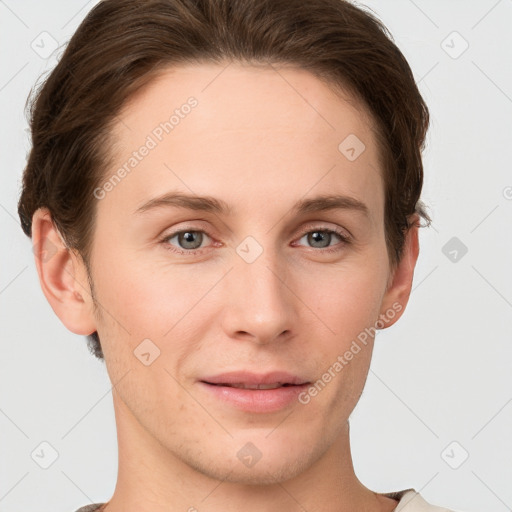 Joyful white young-adult female with short  brown hair and grey eyes