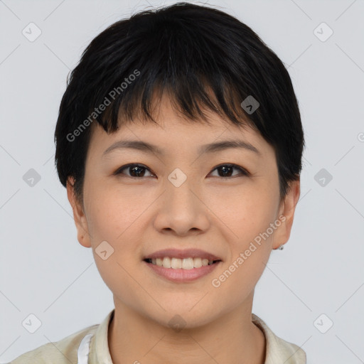 Joyful asian young-adult female with short  brown hair and brown eyes