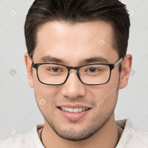 Joyful white young-adult male with short  brown hair and brown eyes