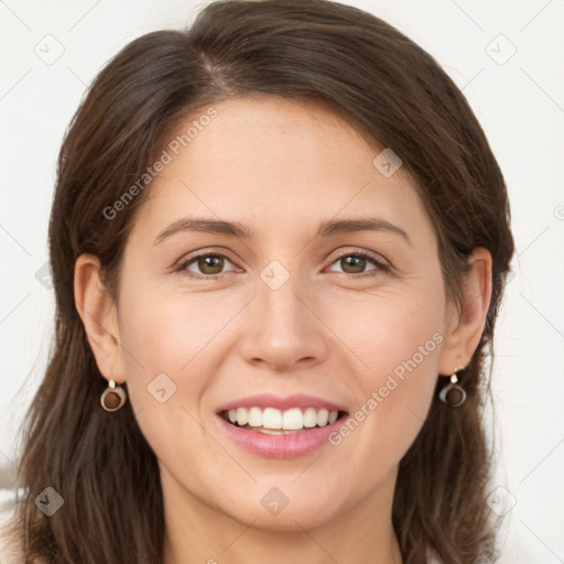 Joyful white young-adult female with long  brown hair and grey eyes