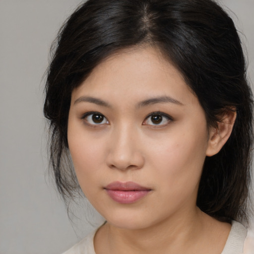 Neutral asian young-adult female with medium  brown hair and brown eyes