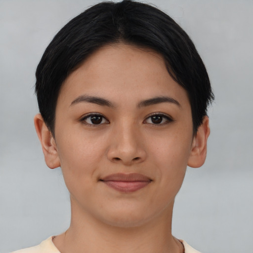 Joyful asian young-adult female with short  black hair and brown eyes