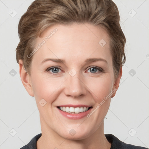 Joyful white young-adult female with short  brown hair and grey eyes