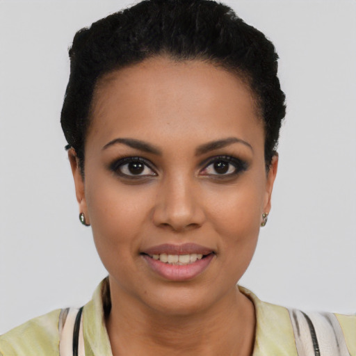 Joyful latino young-adult female with short  brown hair and brown eyes