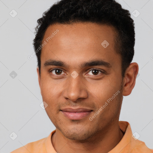 Joyful latino young-adult male with short  black hair and brown eyes