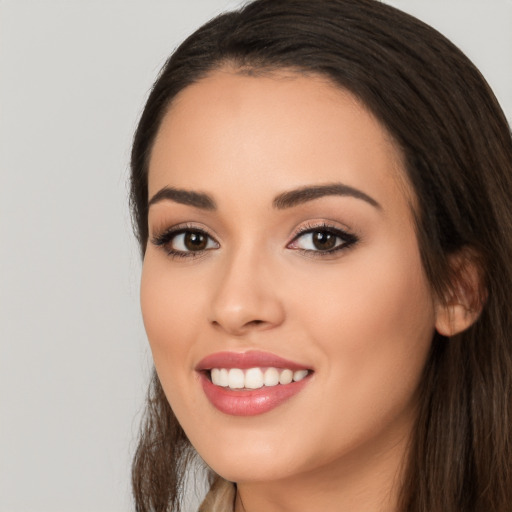 Joyful white young-adult female with long  black hair and brown eyes