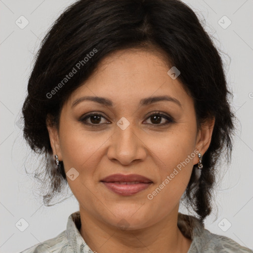 Joyful latino adult female with medium  brown hair and brown eyes