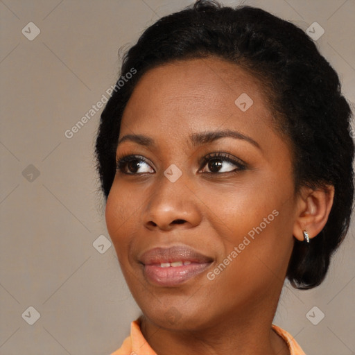 Joyful black young-adult female with medium  black hair and brown eyes