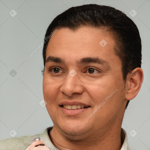 Joyful white adult male with short  brown hair and brown eyes