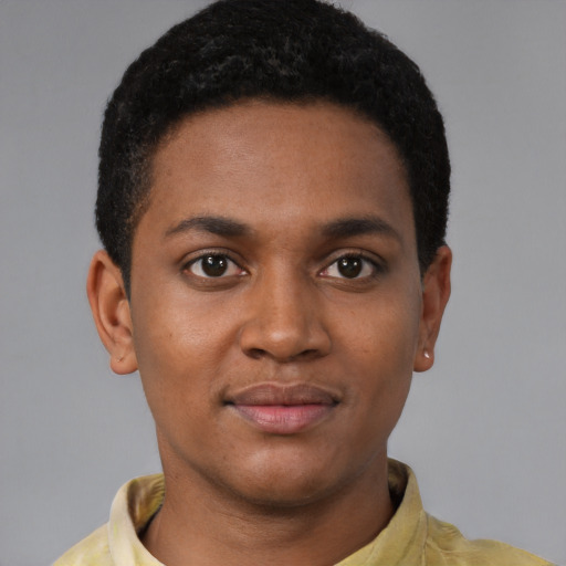Joyful latino young-adult male with short  brown hair and brown eyes