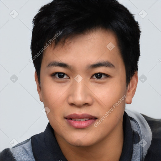 Joyful asian young-adult male with short  black hair and brown eyes