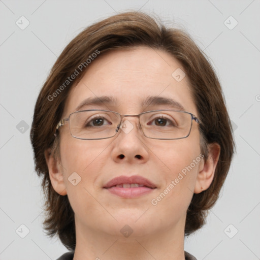 Joyful white adult female with medium  brown hair and green eyes