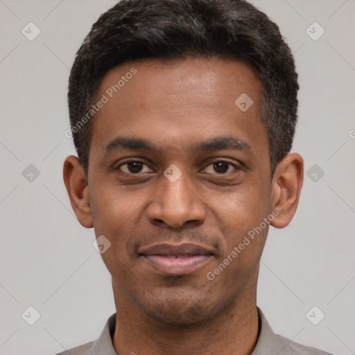 Joyful latino young-adult male with short  black hair and brown eyes