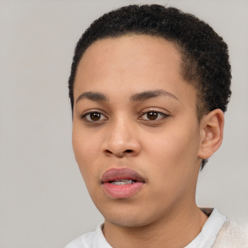 Joyful latino young-adult female with short  black hair and brown eyes