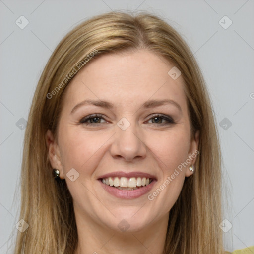 Joyful white young-adult female with long  brown hair and brown eyes