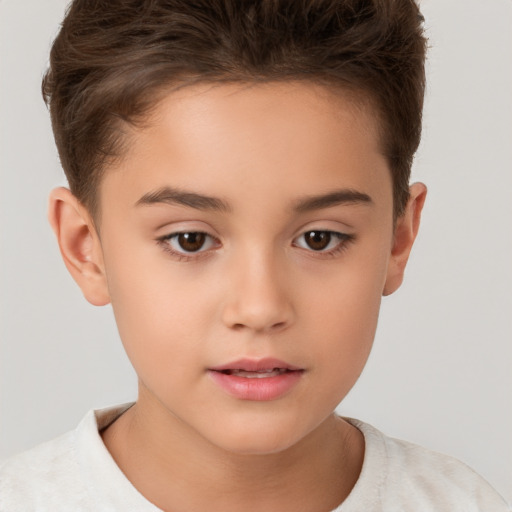 Joyful white child female with short  brown hair and brown eyes