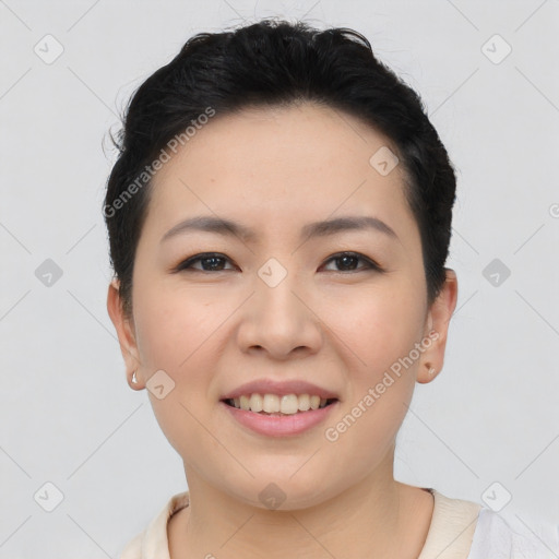 Joyful asian young-adult female with short  brown hair and brown eyes