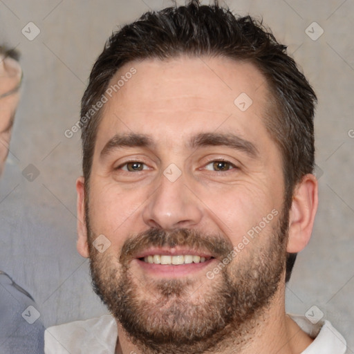 Joyful white adult male with short  brown hair and brown eyes