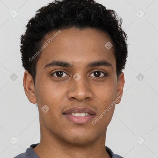 Joyful black young-adult male with short  brown hair and brown eyes