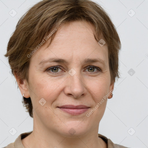 Joyful white adult female with short  brown hair and grey eyes