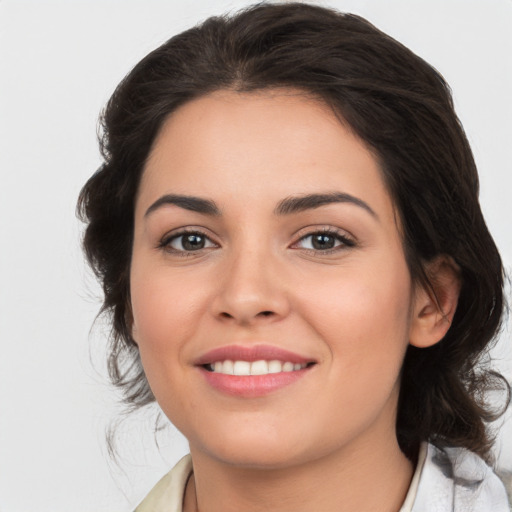 Joyful white young-adult female with medium  brown hair and brown eyes