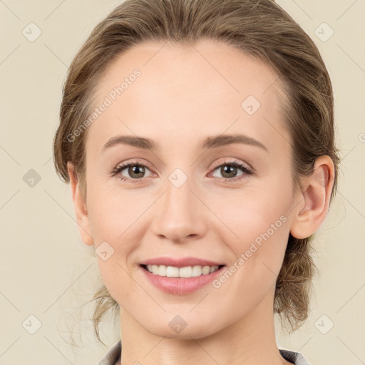 Joyful white young-adult female with medium  brown hair and green eyes