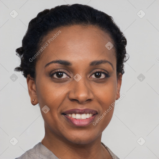 Joyful black young-adult female with short  black hair and brown eyes