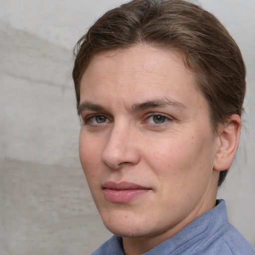 Joyful white adult female with short  brown hair and brown eyes