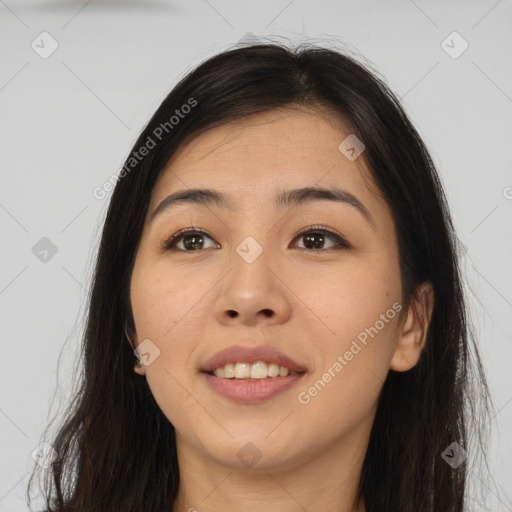 Joyful asian young-adult female with long  brown hair and brown eyes