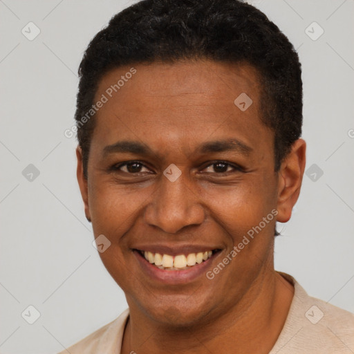 Joyful latino young-adult male with short  brown hair and brown eyes