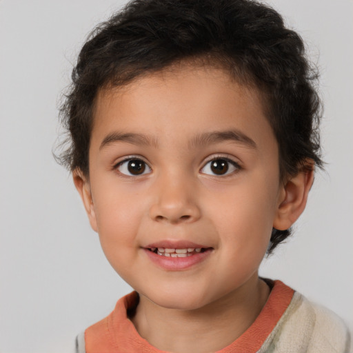 Joyful white child male with short  brown hair and brown eyes