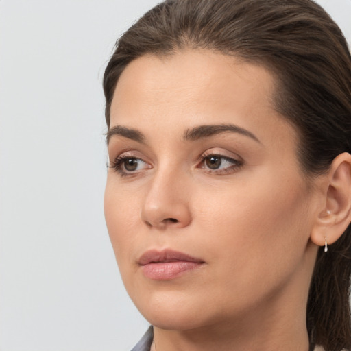 Neutral white young-adult female with medium  brown hair and brown eyes