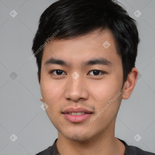 Joyful asian young-adult male with short  brown hair and brown eyes