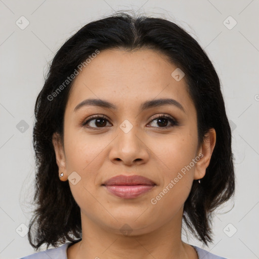 Joyful latino young-adult female with medium  brown hair and brown eyes