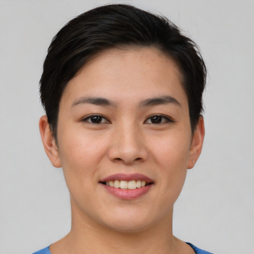 Joyful asian young-adult female with short  brown hair and brown eyes