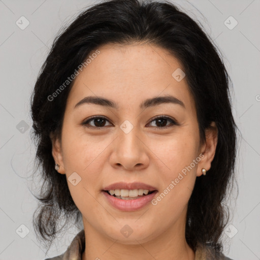 Joyful latino young-adult female with medium  brown hair and brown eyes