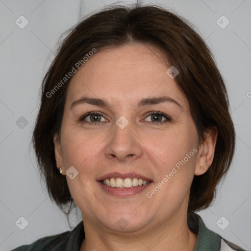 Joyful white adult female with medium  brown hair and brown eyes