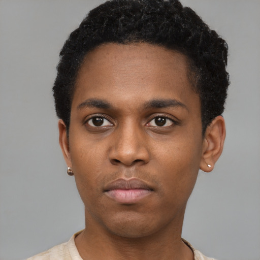 Neutral black young-adult male with short  black hair and brown eyes