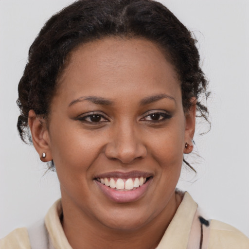 Joyful latino young-adult female with short  brown hair and brown eyes