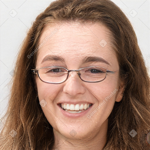 Joyful white adult female with long  brown hair and grey eyes