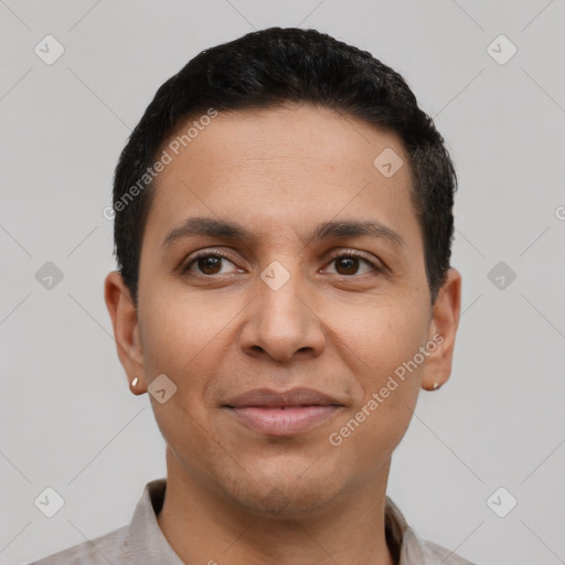 Joyful latino young-adult male with short  black hair and brown eyes