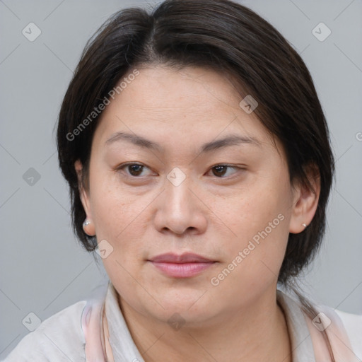 Joyful white adult female with medium  brown hair and brown eyes