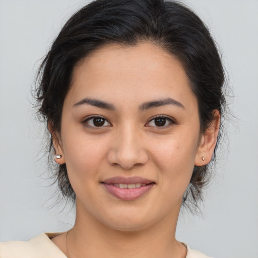 Joyful asian young-adult female with medium  brown hair and brown eyes